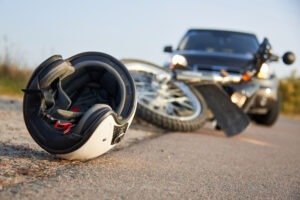 Helmet Motorcycle And Car In The Road