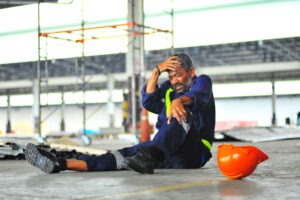 Worker Holding His Knee After A Construction Accident