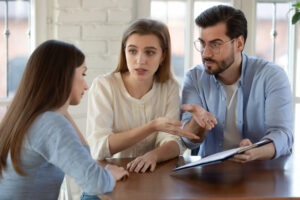 A young couple discusses a catastrophic injury with a lawyer in Speedway.