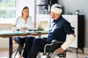 A female personal injury lawyer helps an injured man seek compensation for his traumatic brain injury.