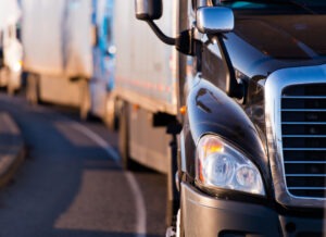 A detail shot of a semi-truck’s mirror.