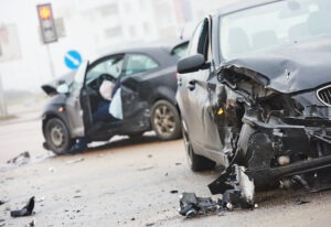 Two severely damaged cars after a crash.