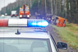 A police vehicle pulls up to the scene of a commercial vehicle accident in Evansville.