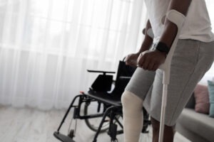 An injured man with crutches in need of a Chesterton, Indiana motorcycle accident injury attorney.