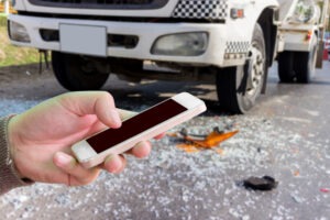 A faceless truck accident survivor calls an attorney after a Walmart truck accident in South Bend.