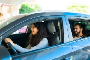 A rideshare driver prepares to take a passenger to their destination.