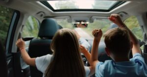 Two children in a rideshare vehicle. A lawyer can explain what to do if your child is in a rideshare accident. 