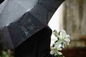 A person at a funeral. Find out how you sue for a family member who died in a motorcycle accident.