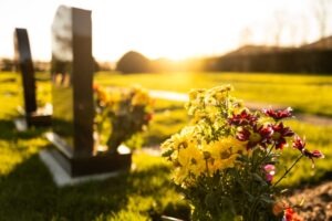 A row of graves. A lawyer can explain how you sue for a family member who died in a truck accident. 