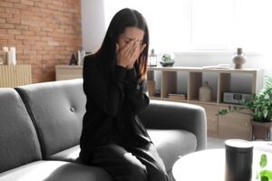 A woman cries after the death of her spouse.