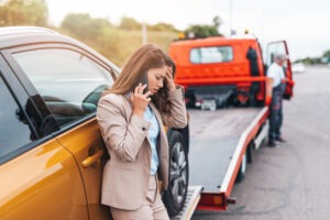 Woman talks to lawyer on phone and has car towed after accident on US 41 in Indiana.