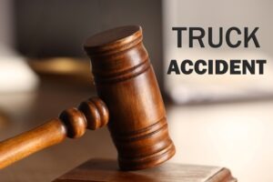 Concept image of a gavel and the words “truck accident.” Represents damages you can recover after an accident with a big truck.