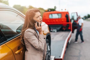 Driver having their vehicle towed after being involved in an accident on one of the top five most dangerous highways in America